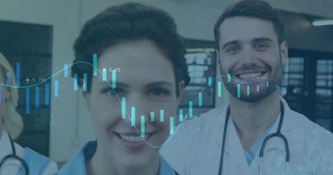Smiling clinicians standing in clinic with transparent medical data visualization overlay