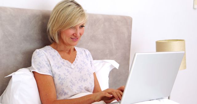 Senior Woman Using Laptop in Bed - Download Free Stock Images Pikwizard.com