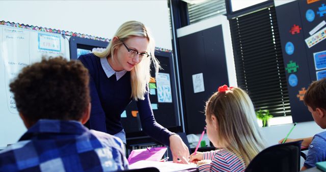 Female Teacher Assisting Students in Classroom Environment - Download Free Stock Images Pikwizard.com