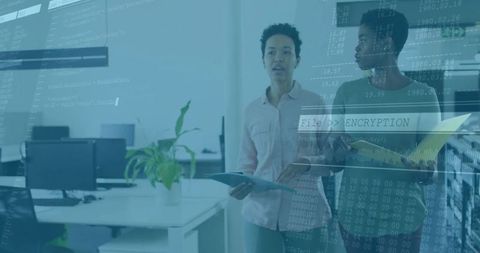 Tech team discussing data encryption in modern office environment