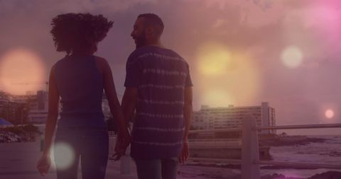 Romantic Couple Holding Hands at Sunset Beach