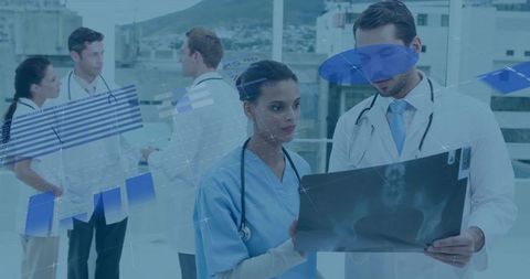 Doctors analyzing x-ray with digital charts on urban roof terrace