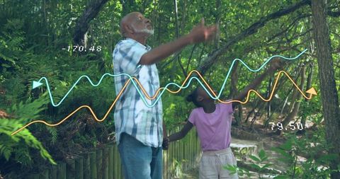 Grandfather and granddaughter exploring forest trail with augmented reality data overlays