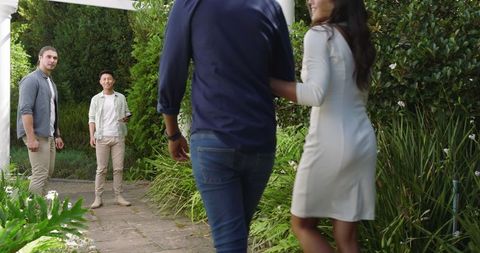 Couple in Loving Embrace Celebrates Special Day in Lush Garden