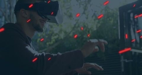 Man Experiencing VR Outdoors with Interactive Technology