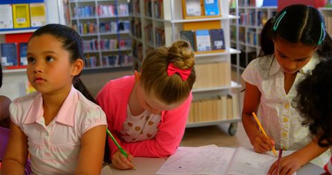 Diverse Kids Collaborating in School Library - Download Free Stock Images Pikwizard.com