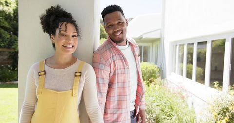 Happy African American Couple in Home Garden Smiling Together