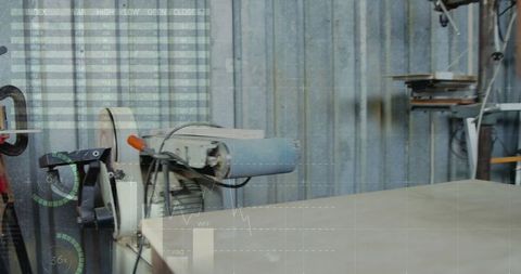 Modern belt sander with data displays in workshop