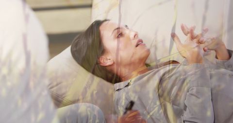 Woman in Therapy Session Overlaid with Grass Imagery