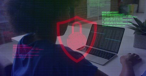 Woman typing code on laptop with red shield padlock overlay highlighting cybersecurity