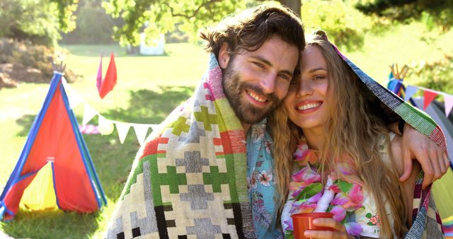 Hipster couple smiling and posing in a festival