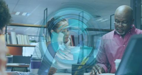 Collaborative Team Reviewing Documents in Modern Office Environment