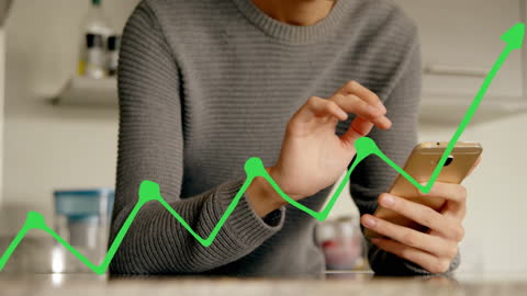 Person Using Smartphone with Digital Growth Graph Overlay
