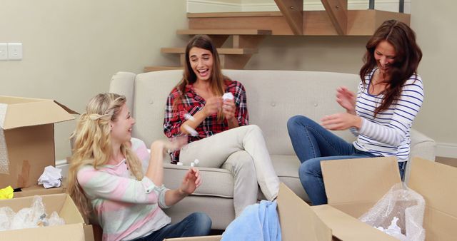 Women Enjoying Unpacking in New Home - Download Free Stock Images Pikwizard.com