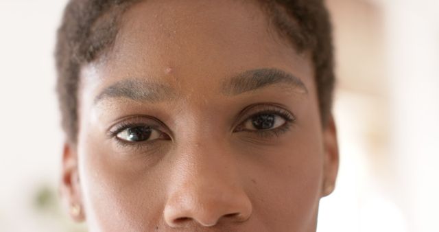Eyes of happy african american casual businesswoman standing in office - Download Free Stock Photos Pikwizard.com
