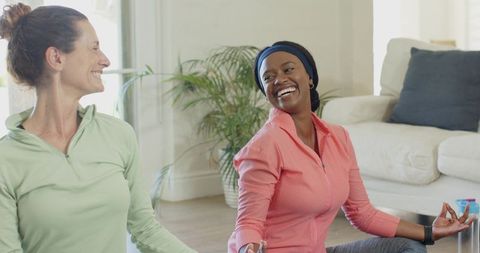 Smiling Women Practicing Yoga for Relaxation and Wellness