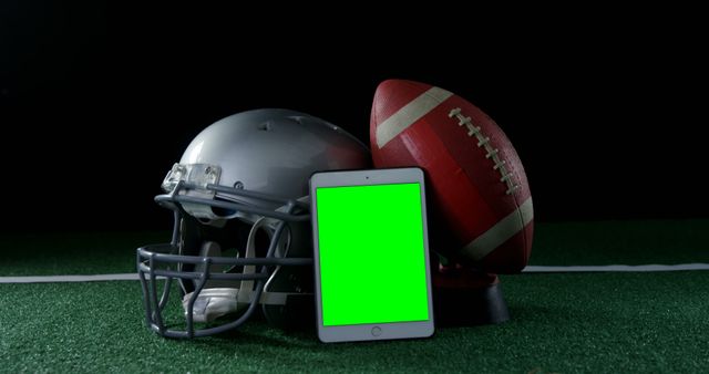 Football Helmet and Ball with Green-Screen Tablet - Download Free Stock Images Pikwizard.com