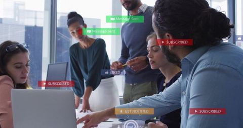 Team Collaborating Around Laptop with Social Media Notifications Overlay for Digital Strategy