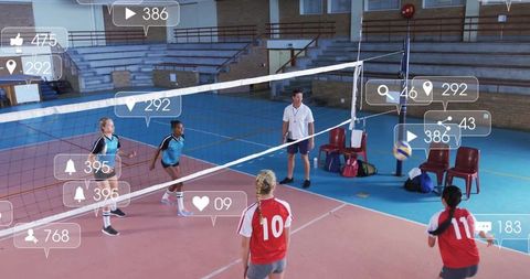 School Students Playing Volleyball in Gym Illustrating Teamwork and Activity