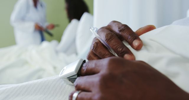 Close-up of Patient's Hands with Pulse Oximeter in Hospital Bed - Download Free Stock Images Pikwizard.com