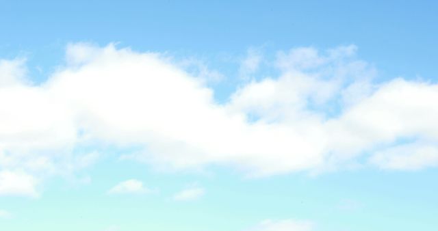 Fluffy white clouds float across a serene blue sky, with copy space - Download Free Stock Photos Pikwizard.com