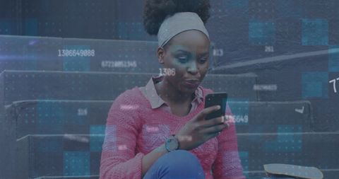 African American Woman Engaging with Technology Outdoors