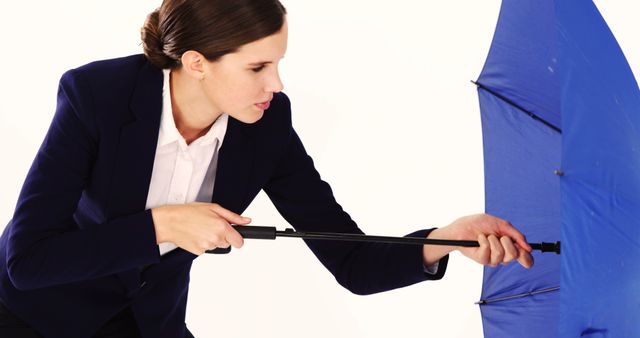 Businesswoman Cloaking Herself Protection Under Blue Umbrella - Download Free Stock Images Pikwizard.com