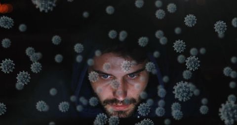 Man Surrounded by Digital Virus Graphics Highlighting Cybersecurity Threats