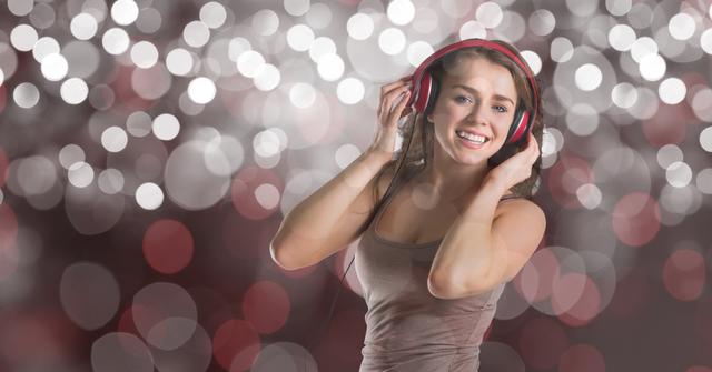 Digital composite of Young woman listening to music against bokeh