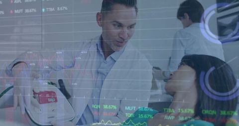 Dentist in lab coat using equipment with stock chart overlays