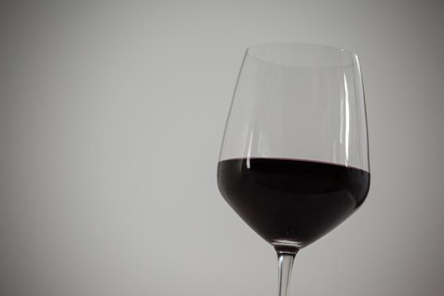 Close-up of red wine against white background during christmas time