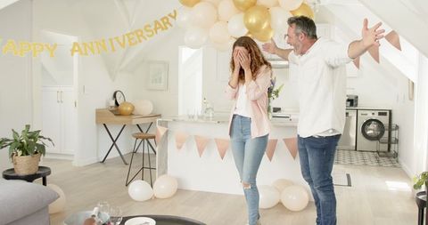 Happy Couple Celebrating Anniversary with Balloons