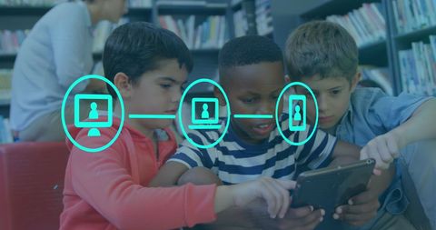 Schoolboys collaborating with tablet and digital network icons