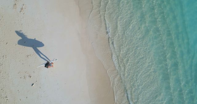 Surfer Carrying Board on White Sand Beach with Aqua Blue Water - Download Free Stock Images Pikwizard.com