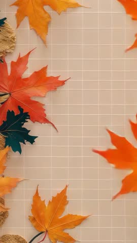 Vertical autumn loop showing maple leaf drifting across grid toward leaf cluster