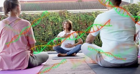 Senior yoga instructor leading breathwork class on patio with dna wellness overlay