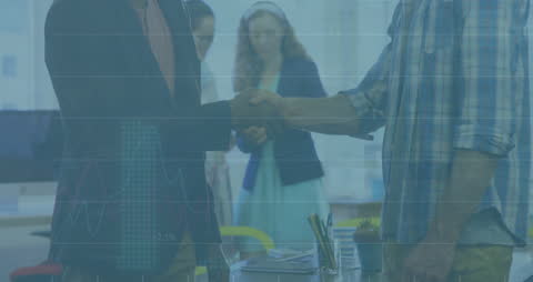 Business Colleagues Shaking Hands in Collaborative Office