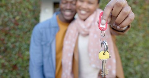Happy Couple Holding Keys to New Home Celebrating Move - Download Free Stock Images Pikwizard.com