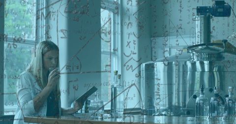 Female Scientist Analyzing Chemical Compounds in Modern Laboratory