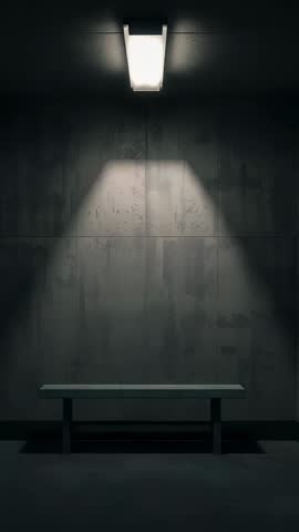 Spotlight Casting Triangle Beam on Concrete Wall Revealing Empty Bench | Vertical Video