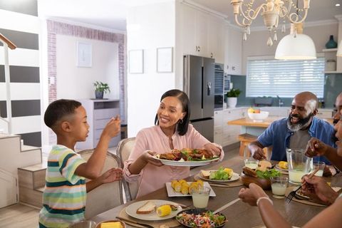 Happy Family Sharing Meal in Modern Kitchen Setting
