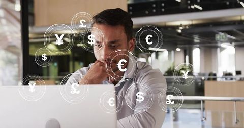 Financial analyst examining currency exchange in modern office