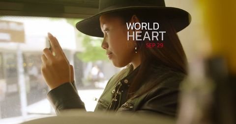 World Heart Day Awareness with Woman Using Smartphone on Bus