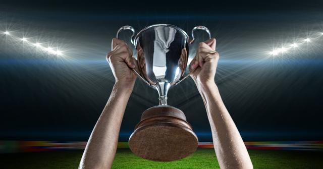 Digital composite image of athlete hands holding trophy