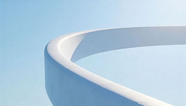 Minimal curved white architectural form sweeping against pale blue sky for modern design