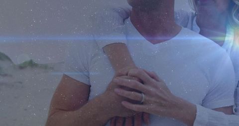 Romantic Mature Couple Embracing on Tranquil Beach