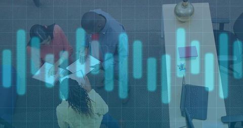 Collaborative team analyzing documents in modern office with digital overlay