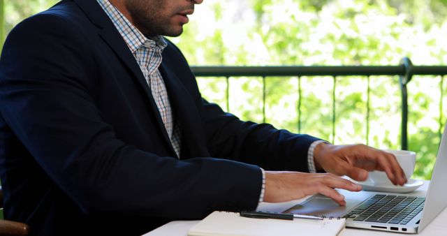 Businessman Working on Laptop Outside in Bright Daylight - Download Free Stock Images Pikwizard.com