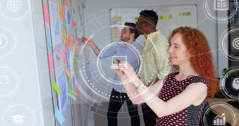 Creative team collaborating with sticky notes and digital HUD during agile brainstorming