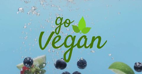 Go vegan message with fresh fruit in water background